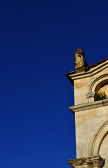 Wall Mural - Corner of Lucca medieval Church of Santa Maria Forisportam facade, completed in the 12th century (with blue sky and copy space)