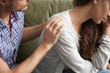 © fizkes - Helping caring husband apologizing comforting wife, understanding man expressing sympathy encouraging upset woman, apology and forgiveness, support in marriage concept, hand on shoulder close up view
