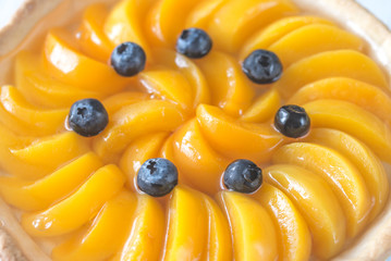 Wall Mural - Tart with peaches and blueberry