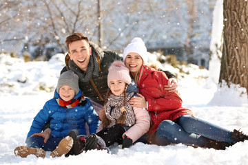 Wall Mural - Portrait of happy family in winter park