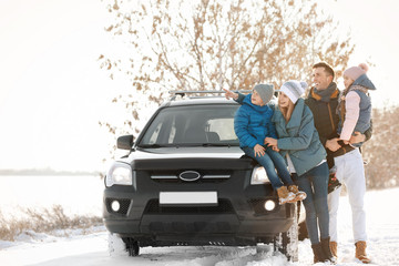 Poster - Happy family near car on winter day