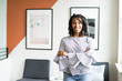© R. Dione Foto/Creative Flame - Portrait of businesswoman standing in office