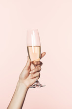 Cropped Shot Of Woman Cheering By Champagne Glass Isolated On Pink Background