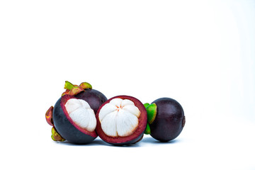 Two whole purple mangosteen and two cross section isolated on white background. Tropical fruit from Thailand. The queen of fruits. Asia fresh fruit market. Natural source of tannin and xanthones