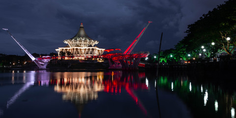 Wall Mural - Waterfront view of the Sarawak River at night in Kuching, Borneo, Malaysia