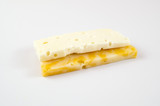 Fototapeta  - Pieces of marbled cheese and brinza on a light background