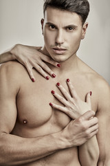 YOUNG NAKED MAN WITH FEMALE HANDS WITH RED NAILS