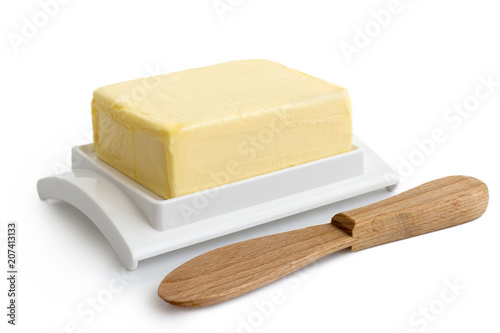 Fotografia, Obraz A whole block of butter on white plastic butter dish isolated on white