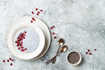 Wall Mural - Healthy breakfast set. Chia seed pudding bowls with pomegranate.