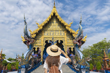 Tourist Is Traveling At Blue Temple (Wat Rong Suea Ten) In Chiangrai, Thailand.