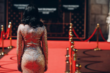 Woman In A Luxurious Dress On A Red Carpet