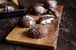Cocoa biscuits with coconut filling, decorated with chocolate and grated coconut