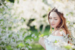 © Volodymyr Shcherbak - Close up romantic portrait of beautiful elegant woman in blossom spring trees.