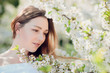 © Volodymyr Shcherbak - Close up romantic portrait of beautiful elegant woman in blossom spring trees.