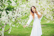 © Volodymyr Shcherbak - Close up romantic portrait of beautiful elegant woman in blossom spring trees.