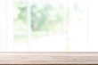 © successphoto - Empty wooden table and window room interior decoration background, product montage display,can be used for display or montage your products.Mock up for display of product.