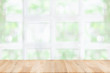 © successphoto - Empty wooden table and window room interior decoration background, product montage display,can be used for display or montage your products.Mock up for display of product.
