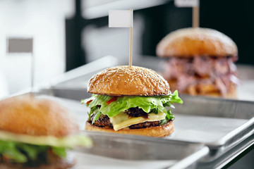 Wall Mural - Food. Closeup Burgers And Hamburgers In Fast Food Restaurant