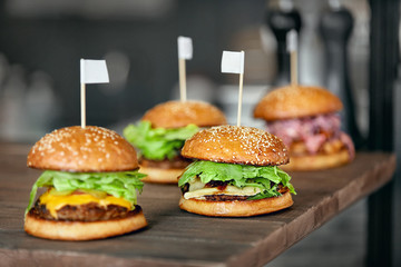 Wall Mural - Food. Closeup Burgers And Hamburgers In Fast Food Restaurant