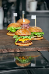 Wall Mural - Food. Closeup Burgers And Hamburgers In Fast Food Restaurant