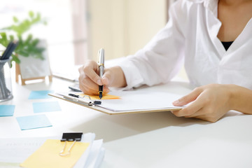 Business woman working at work table,home office desk background, Desk musicians,checklist planning investigate enthusiastic concept.