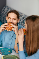 Wall Mural - Friends Eating Burgers Indoors