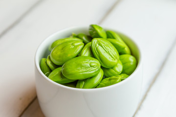 Sticker - Petai, Bitter Beans on wood table, Thai vegetable food, Parkia speciosa seeds