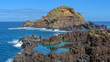 Porto Moniz. Natural swimming pools. The automated Lighthouse in front is situated on the top of 'Ilheu Mole'. Madeira Island, Portugal.