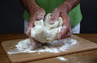 Baker preparing some dough ready to bake some bread