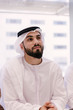 © oneinchpunch - Arabian businessman with kandora portrait in office