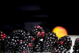 Fototapeta  - Bunch of blackberries together ın black background.