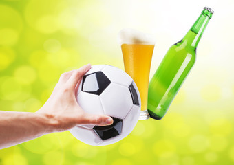 Creative poster for football and beer, man hand holding soccer ball with fresh beer