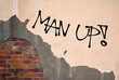 Man Up - Handwritten graffiti sprayed on the wall - motivation and challege to be strong, brave, bold and courageous male instead of being weak and unmanly man. 