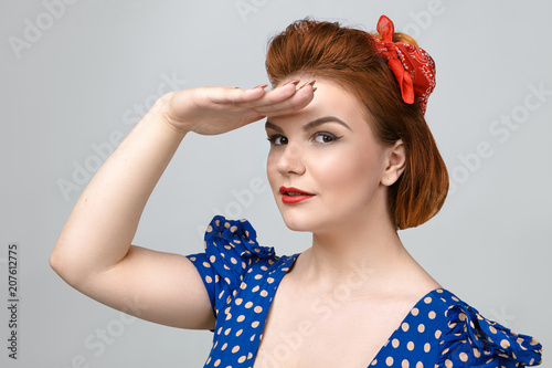Studio Shot Of Beautiful Gorgeous Red Haired Pin Up Girl In Blue