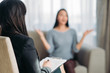 © Nomad_Soul - Female patient sitting on sofa at psychotherapist