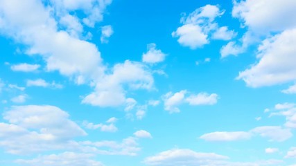 Wall Mural - Light blue sky and white cumulus clouds - Seamless loop timelapse 4K