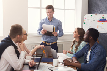 Aufkleber - Man giving presentation to colleagues in office