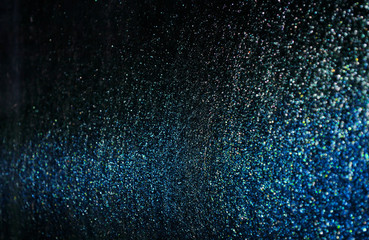 Wall Mural - blue sparkling and shining star points on a black isolated background and a blue bright flash will c