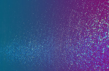 Wall Mural - blue sparkling and shining star points on a gradient blue violet background and a blue bright flash 