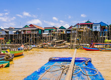 Picturesque Kampong Phluk Floating Village With Multicolored Boats And Stilt Houses, Tonle Sap Lake, Siem Reap Province, Cambodia
