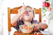 © soupstock - Boy eating colorful breakfast cereal