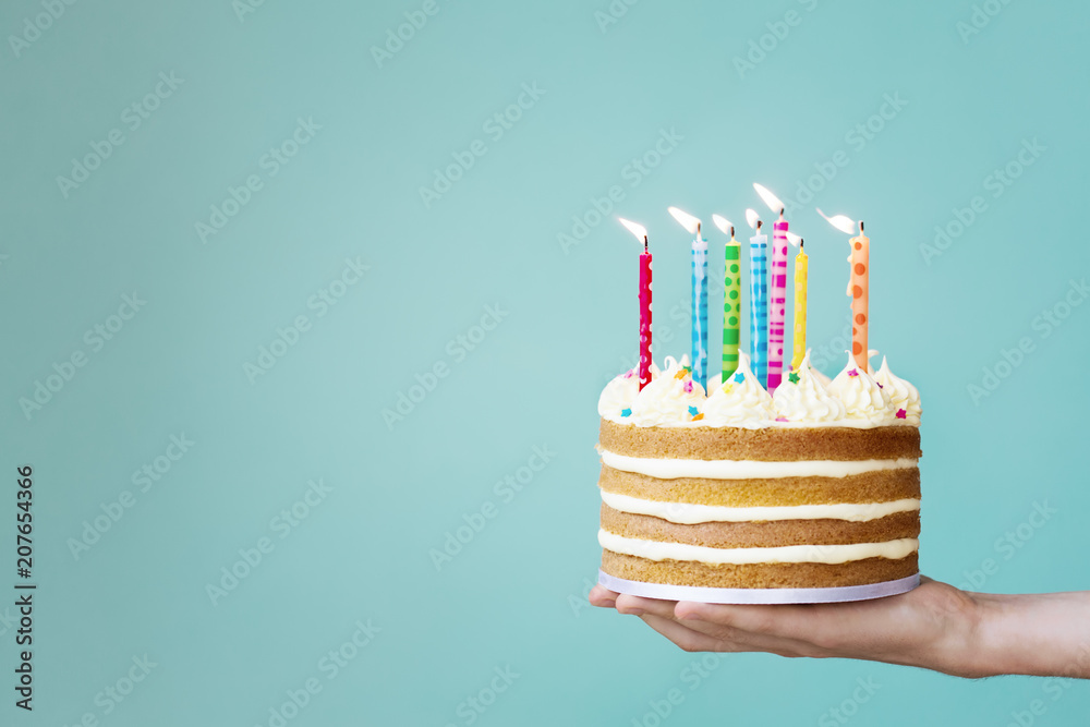 Birthday cake with colorful candles Stock Photo | Adobe Stock