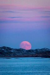 moonrise at skandinavian winter red moon