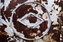 Symbols On An Old Metal Surface With Paint Residues And Traces Of Corrosion.