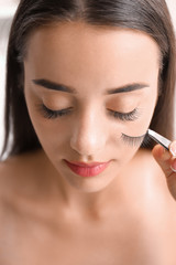 Poster - Attractive young woman with false eyelashes, closeup