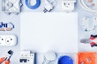 © Sergey - Different electrical tools and equipments with white paper for text.Electrical background.Top view.