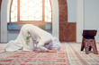 © FS-Stock - Young beautiful Muslim Woman Praying In Mosque