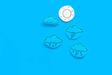 Wall Mural - modern weather icons set on blue background top view copy space