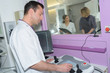 © auremar - technician working at ct scan in modern hospital