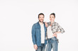© LIGHTFIELD STUDIOS - portrait of happy couple looking at camera isolated on white